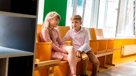 Ivan Pinchuk sits next to another student at Irpin&#39;s School Number 17. 