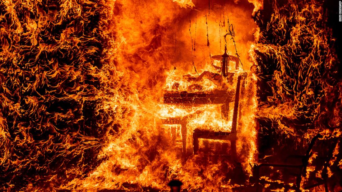 Flames engulf a chair inside a burning home in Mariposa County, California, on July 23. The &lt;a href=&quot;https://www.cnn.com/2022/07/27/us/gallery/oak-fire-california/index.html&quot; target=&quot;_blank&quot;&gt;Oak Fire,&lt;/a&gt; which started near Yosemite National Park, burned nearly 20,000 acres and is California&#39;s &lt;a href=&quot;https://www.cnn.com/2022/07/26/us/california-oak-fire-yosemite-mariposa-county-tuesday/index.html&quot; target=&quot;_blank&quot;&gt;biggest wildfire&lt;/a&gt; of the year. The challenging terrain and abundant dry vegetation fueling the wildfire complicated efforts to tamp down its growth, a Cal Fire spokesperson told CNN.