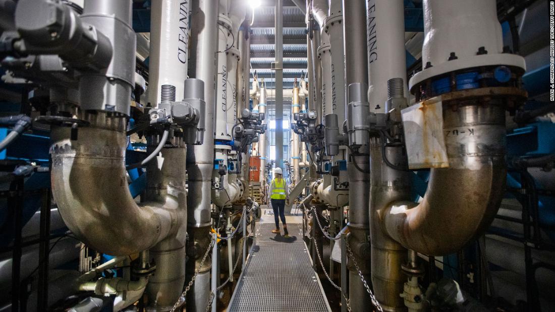 Michelle Peters, a technical and compliance manager for Poseidon Water, walks through the reverse osmosis building at the Claude Lewis Carlsbad Desalination Plant in Carlsbad, California, on March 30. The plant converts ocean water into municipal water. In August, Gov. Gavin Newsom laid out a &lt;a href=&quot;https://www.cnn.com/us/live-news/lake-mead-colorado-river-report/h_8b9a61776c746ca11392b63b158381f6&quot; target=&quot;_blank&quot;&gt;multi-billion-dollar plan&lt;/a&gt; to preserve the state&#39;s diminishing water supply for future years, which includes recycled water projects such as desalination of ocean water and salty water in groundwater basins.
