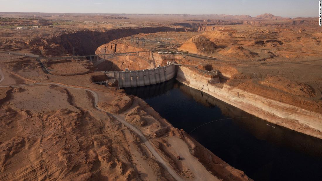 An aerial view of Lake Powell and the Glen Canyon Dam in Page, Arizona, on April 20. The Department of the Interior said on August 16 it is prepared to&lt;a href=&quot;https://www.cnn.com/us/live-news/lake-mead-colorado-river-report/h_fbe5949c463a6e7e255e321f36de757e&quot; target=&quot;_blank&quot;&gt; take action to limit the water releases&lt;/a&gt; from Lake Powell to prevent it from plunging below 3,525 feet above sea level by the end of 2023. Below that level, the Glen Canyon Dam, which forms the reservoir, cannot produce hydropower. 