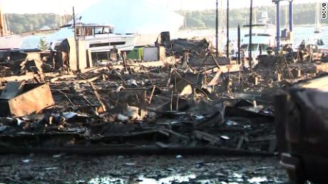 More than 100 firefighters responded to a massive fire at a boatyard in Mattapoisett, Massachusetts that damaged dozens of boats and cars as well as several structures on Friday. 