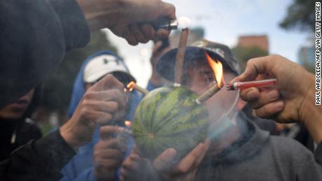People take part in a rally to commemorate World Cannabis Day in Bogota in April 2022.