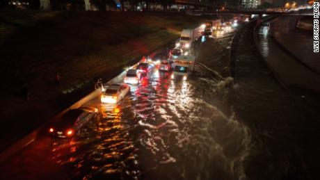 Floodwater early Monday inundates vehicles on Interstate 30 in downtown Dallas.