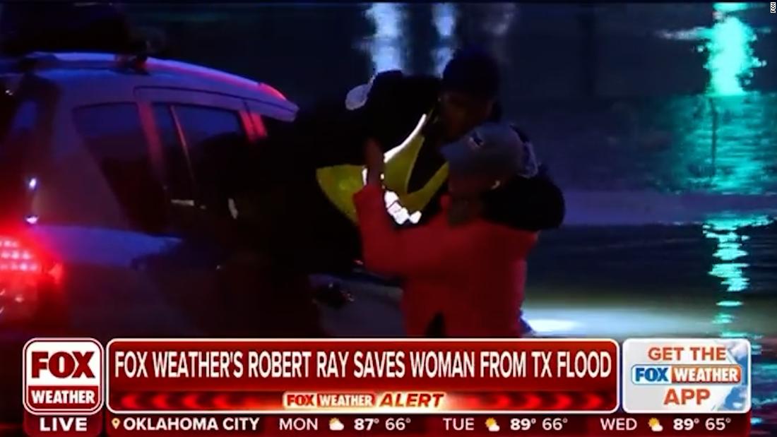 Watch weather reporter rescue woman from flood waters on air