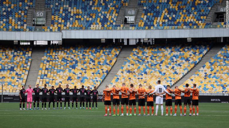 Shakhtar Donetsk and Metalist 1925 Kharkiv players during a moment of silence for people who have lost their lives as Russia&#39;s attack on Ukraine continues.