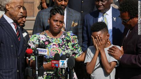 Jacob Patterson, son of the Buffalo shooting victim Heyward Patterson, is comforted by his mother, Tirzah Patterson, May 19, 2022.