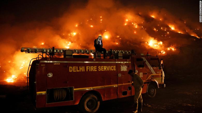 Smoke billows from burning garbage at the Bhalswa landfill in New Delhi, India, April 27, 2022. 