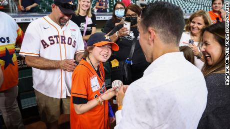 Mayah, shown at Tuesday's Astros game, endured more than 20 surgeries after the shooting in May.