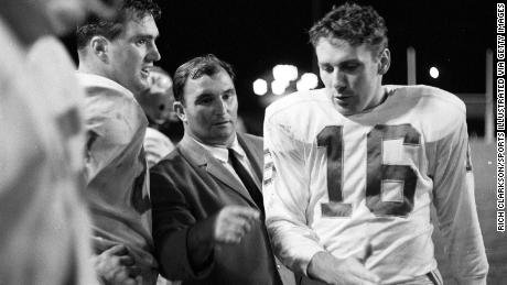 Dawson chats with Chiefs coach Hank Stram on the sidelines during a game against the Denver Broncos. 