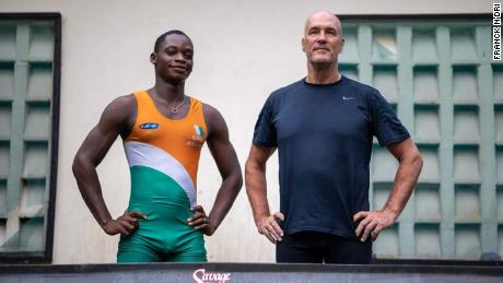 Franck N&#39;Dri (left) stands next to his rowing coach and Canadian former Olympic rower Timothy Turner.