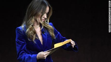 US director and actress Olivia Wilde holds an envelope reading &quot;personal and confidential&quot; as she speaks onstage during the Warner Bros. Pictures &quot;The Big Picture&quot; presentation during CinemaCon 2022 at Caesars Palace in Las Vegas, Nevada on April 26, 2022. 