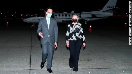 US Sen. Marsha Blackburn, R-Tenn. walks with Douglas Yu-Tien Hsu, director-general of Taiwan&#39;s Deptartment of North American Affairs, as she arrives on a plane in Taipei on Thursday.