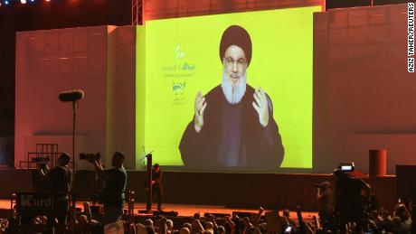 Lebanon&#39;s Hezbollah leader Hassan Nasrallah appears on a screen as he addresses his supporters during a rally in Beirut&#39;s southern suburbs in Lebanon on Monday.