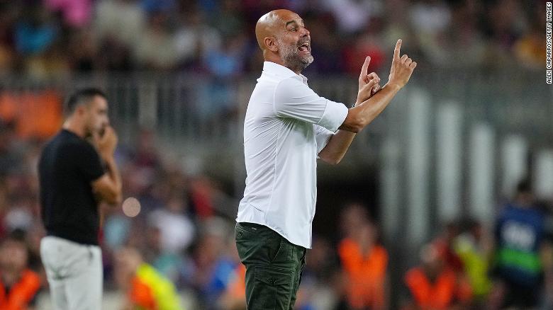 Guardiola delivers instructions to his Manchester City side against Barcelona. 