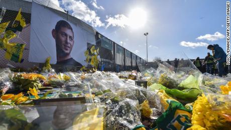 FC Nantes supporters gather in front of a portrait of late Argentinian forward Emiliano Sala at the La Beaujoire stadium on February 10, 2019.