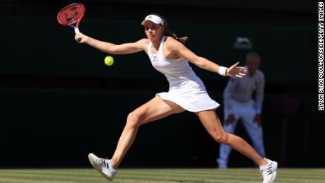 Rybakina returns a shot against Jabeur in the Wimbledon final. 