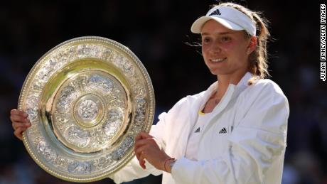 Rybakina celebrates with the trophy after beating Ons Jabeur in the Wimbledon final.