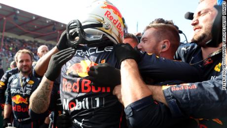 Verstappen celebrates with his Red Bull team after winning the Belgian GP. 