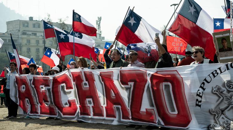 People demonstrate against the draft of the new constitution in Santiago in August.