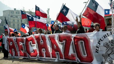 People demonstrate against the draft of the new constitution in Santiago in August.