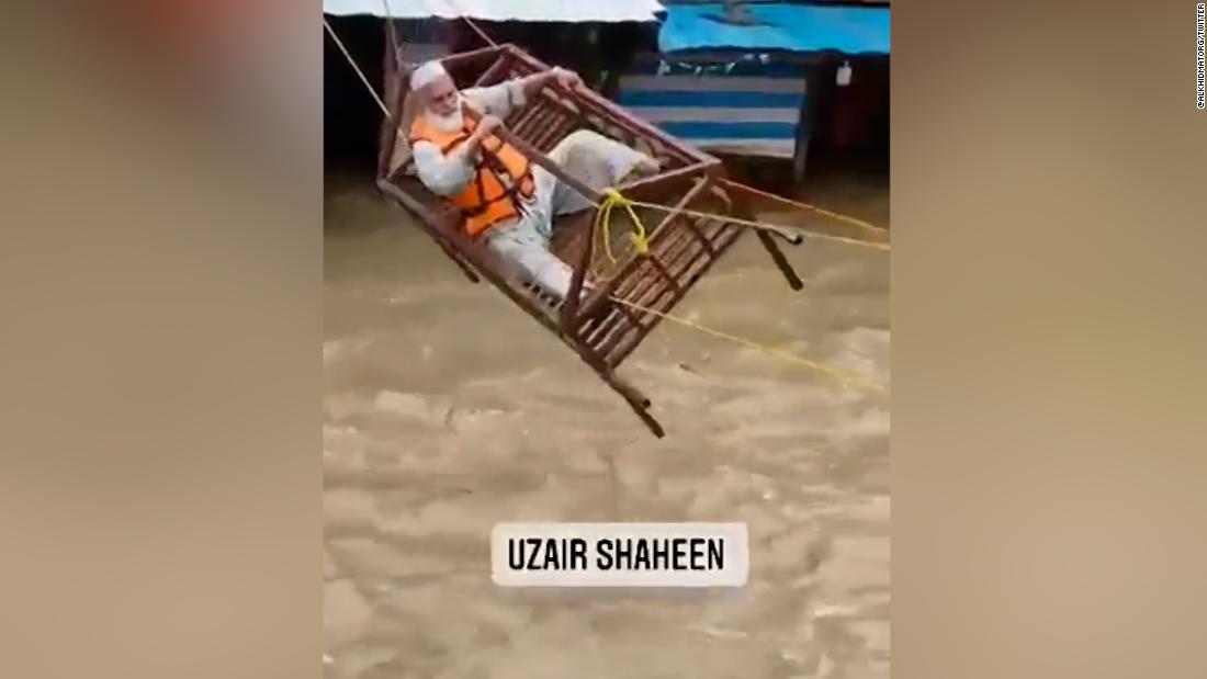 Video: People stranded by Pakistan floods rescued using bedframe – CNN Video