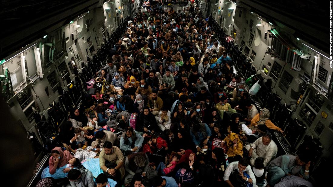 People sit inside a military aircraft during an evacuation from Kabul in August 2021. The US Air Force &lt;a href=&quot;https://www.cnn.com/world/live-news/afghanistan-taliban-us-news-08-20-21/h_e066c6b39a904ab84d766a8f77176b1f&quot; target=&quot;_blank&quot;&gt;evacuated approximately 3,000 people&lt;/a&gt; from Kabul&#39;s international airport that day, according to a White House official. The official said the group contained nearly 350 US citizens, family members of US citizens, Special Immigrant Visa applicants and their families, and other vulnerable Afghans. Some civilian charter flights had also departed the Kabul airport in the previous 24 hours.