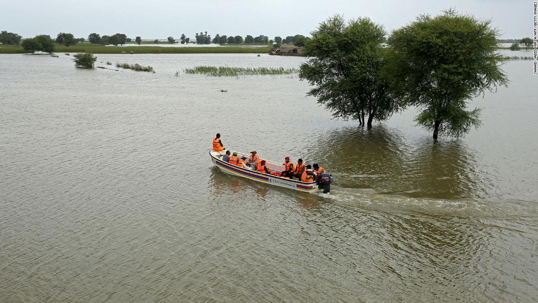 Rescue workers carry out an evacuation operation for stranded people in Rajanpur on August 25.