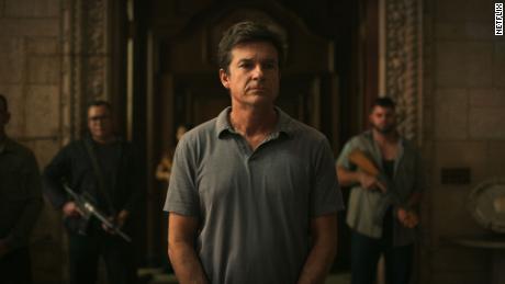 Marty Byrde (Jason Bateman) stands flanked by armed guards at the home of drug lord Omar Navarro on &quot;Ozark.&quot;