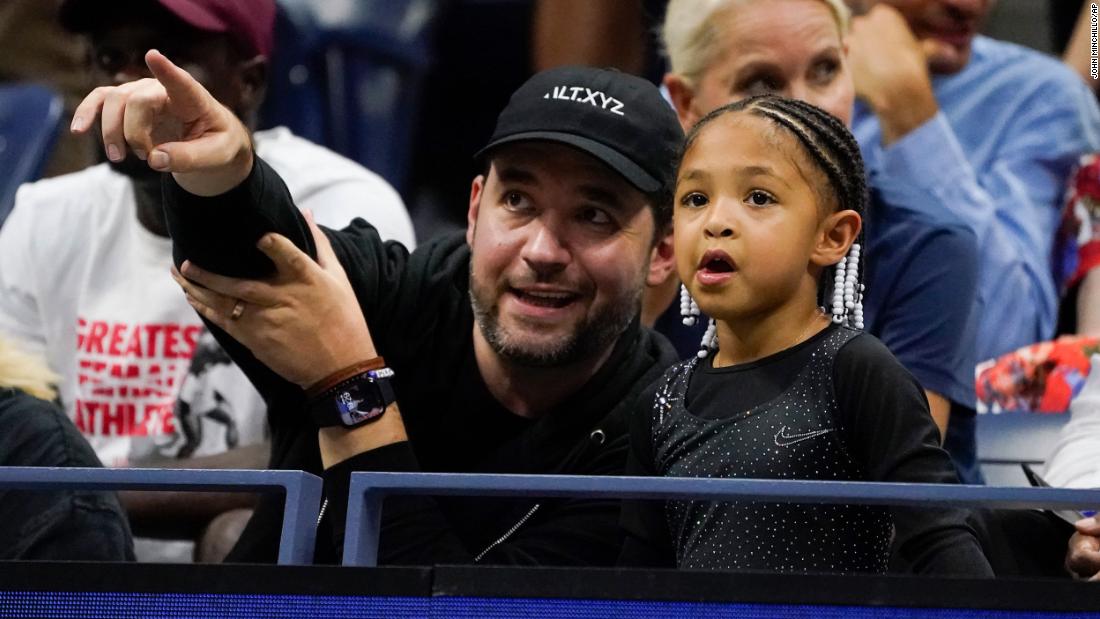 Williams' husband, Alexis Ohanian, watches Monday's match with their daughter, Olympia.