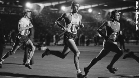 Wottle (left) races behind the US&#39; Jim Ryun (center) at Crystal Palace in London.  