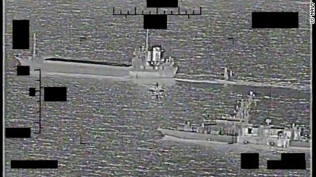 Screenshot of a video showing support ship Shahid Baziar, left, from Iran's Islamic Revolutionary Guard Corps Navy unlawfully towing a Saildrone Explorer unmanned surface vessel in international waters of the Persian Gulf as U.S. Navy patrol coastal ship USS Thunderbolt approaches in response, Aug. 30. 