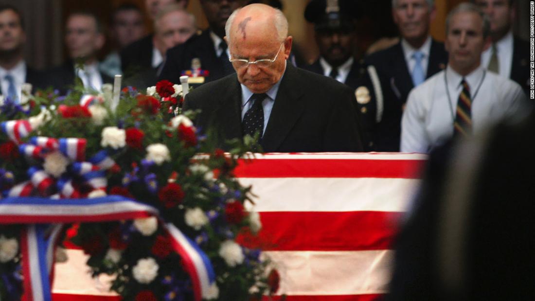 Gorbechev bows his head at Reagan's funeral in June 2004.