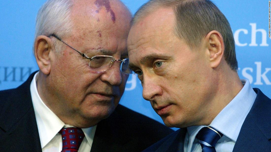 Gorbachev talks to Russian President Vladimir Putin before a news conference in Germany in December 2004.