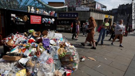 Waste overflows from bins during a strike by workers in Edinburgh, Scotland, on August 27.