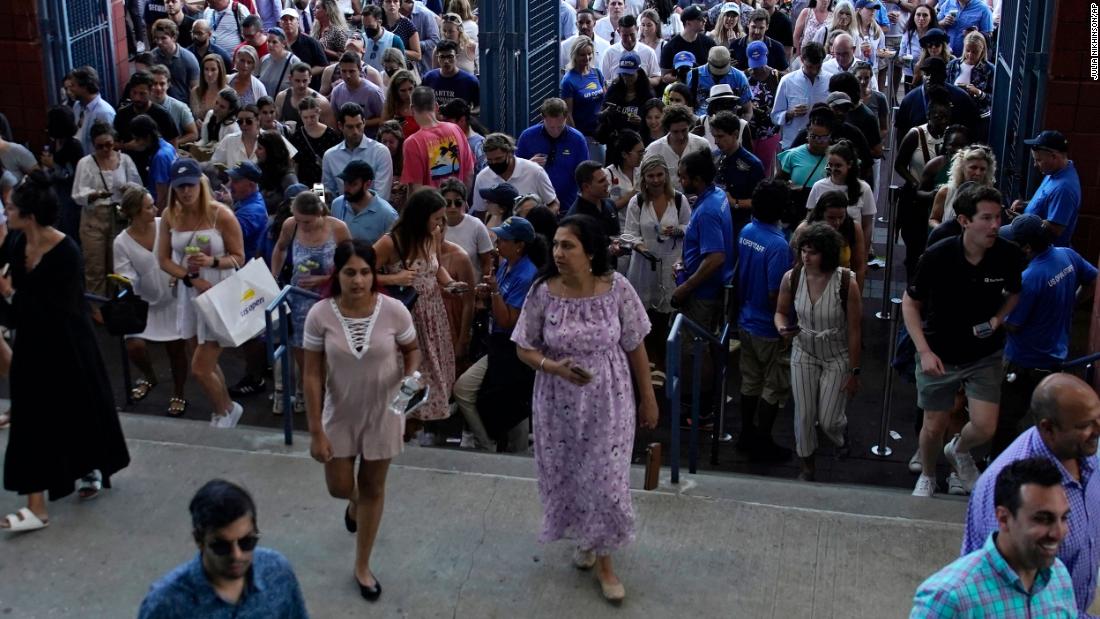 Fans enter Arthur Ashe Stadium for Wednesday&#39;s match.