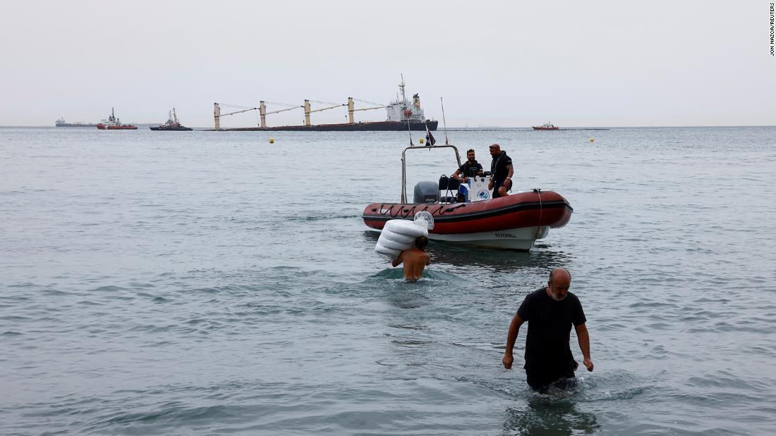 Gibraltar races to stop oil leak from beached cargo ship after collision with gas tanker