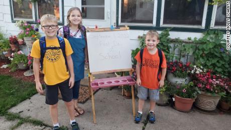 According to Molly Schmitz, her three children, Jack, Lily and Jace, have recycled and reused many of their school supplies, including backpacks, this year.