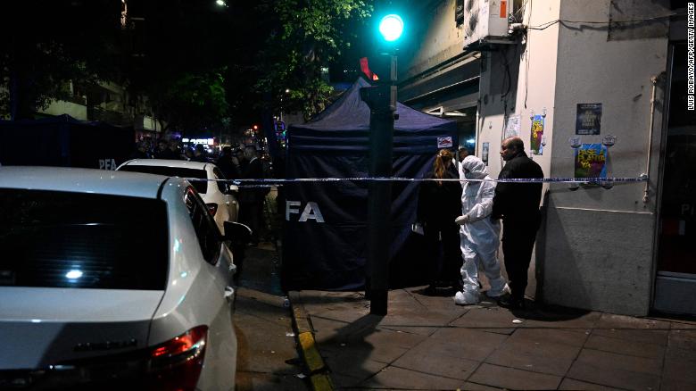 Police work behind a security cordon after a man pointed a gun at Argentine Vice-President Cristina Fernandez de Kirchner outside her residence in Buenos Aires on September 1.