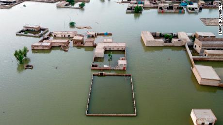 Homes are surrounded by floodwaters in Jaffarabad, a district of Pakistan&#39;s southwestern Balochistan Province, on September 1, 2022. 