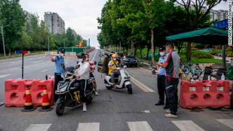 A police checkpoint during restrictions imposed in Chengdu, Sichuan province, due to an outbreak of Covid-19. 