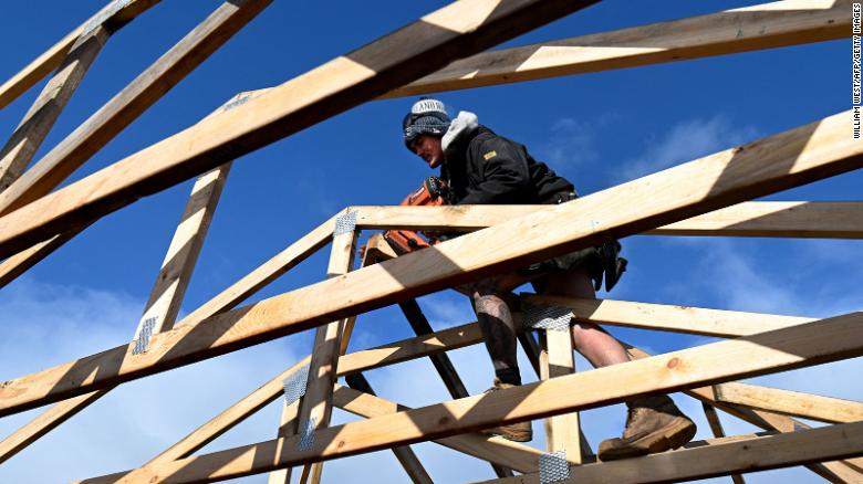 A builder works on a new house on the outskirts of Melbourne on June 7, 2022.