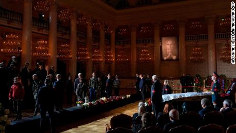People walk past the coffin of former Soviet President Mikhail Gorbachev inside the Pillar Hall of the House of the Unions during a farewell ceremony in Moscow, Russia, Saturday, Sept. 3, 2022. Gorbachev, who died Tuesday at the age of 91, will be buried at Moscow&#39;s Novodevichy cemetery next to his wife, Raisa, following a farewell ceremony at the Pillar Hall of the House of the Unions, an iconic mansion near the Kremlin that has served as the venue for state funerals since Soviet times. (AP Photo/Alexander Zemlianichenko)