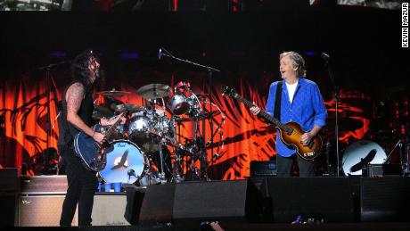 Grohl and McCartney perform at the first of two tribute concerts for Hawkins. 