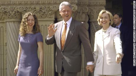 Then-President Bill Clinton, first lady Hillary Clinton and daughter Chelsea seen leaving a restaurant.