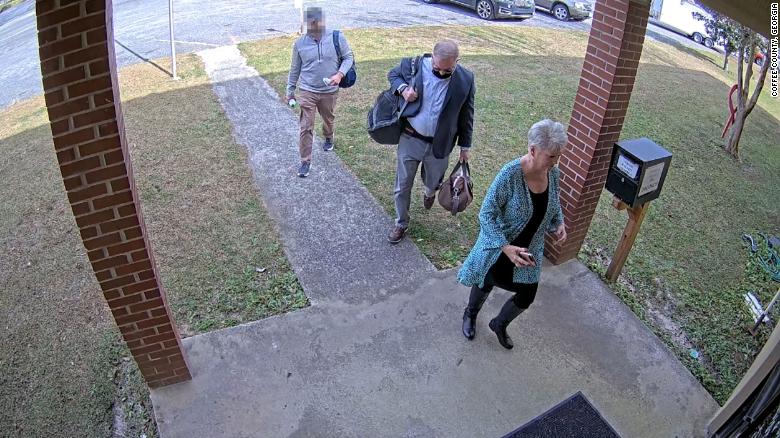 Newly obtained surveillance video shows fake Trump elector escorted operatives into Georgia county’s elections office before voting machine breach