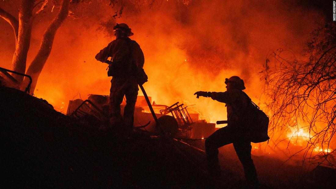 2 people were killed and multiple structures destroyed after a fast-moving wildfire erupted in Southern California