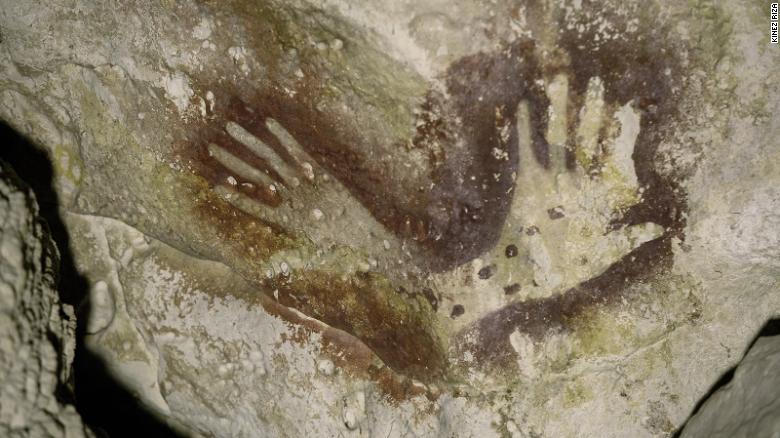 Hand stencils were found in the cave where the amputated skeleton was discovered.  