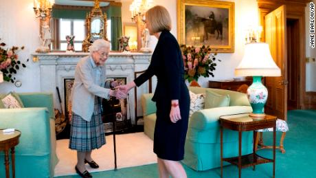 Britain's Queen Elizabeth II, left, welcomes Blaise Truss during a meeting in Balmoral, Scotland, where she invited the newly elected leader of the Conservative Party to become prime minister and form a new government, Tuesday, September 6, 2022. 