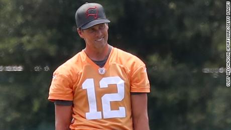 Brady smiling during a Bucs training camp session.