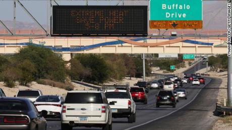A digital road sign on Summerlin Parkway displays a message asking drivers to conserve power due to extreme heat in Las Vegas on Wednesday.